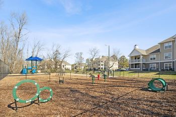 the preserve at ballantyne commons park with playground equipment and apartment buildings